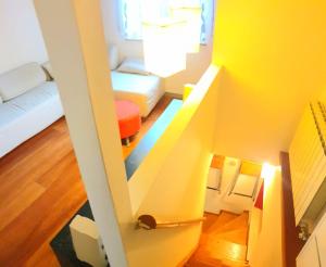 Un pat sau paturi într-o cameră la Casa Chicca a Monfalcone +3 fotografii