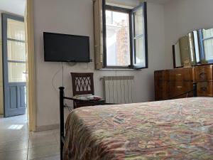 Телевизор и/или развлекательный центр в Casa Modica vista Etna