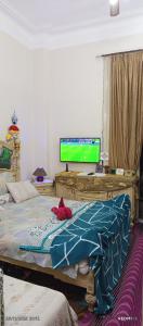 Ένα ή περισσότερα κρεβάτια σε δωμάτιο στο down town besaid auc