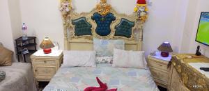 Ένα ή περισσότερα κρεβάτια σε δωμάτιο στο down town besaid auc