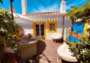 a porch of a house with a patio at Les Bains in La Guérinière