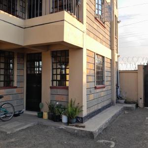 a building with plants in front of it at Swali residence in Nakuru
