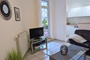 TV a/nebo společenská místnost v ubytování Ferienwohnung im Kurviertel 504