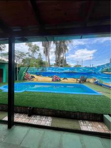 a view of a swimming pool through a window at Quinta La Ramona in Candelaria