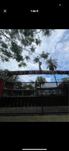 a bird sitting on top of a metal fence at Quinta La Ramona in Candelaria