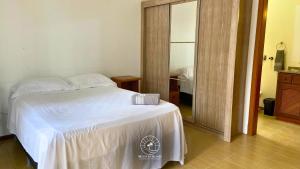 Ένα ή περισσότερα κρεβάτια σε δωμάτιο στο Apto de verão a 300mts do mar – Aceita pet