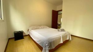 Giường trong phòng chung tại Apto de verão a 300mts do mar – Aceita pet