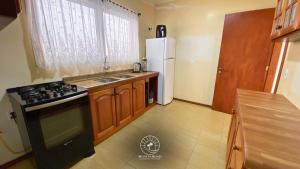 Η κουζίνα ή μικρή κουζίνα στο Apto de verão a 300mts do mar – Aceita pet