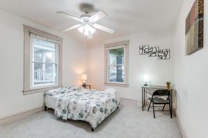 a bedroom with a bed and a ceiling fan at Great for Long Stays! RVA Home with Yard Near Dtwn in Richmond