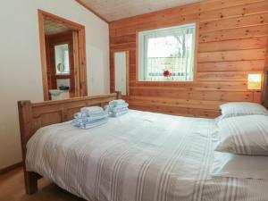 En eller flere senge i et værelse på Woodlands View