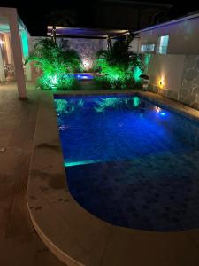 Πισίνα στο ή κοντά στο Casa com Piscina Jacuzi e Salão de Jogos