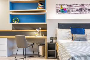 Ένα ή περισσότερα κρεβάτια σε δωμάτιο στο Iconinc Gravity