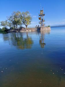 an island in the middle of a body of water at Selene in Villa Rumipal