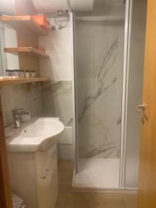 a bathroom with a shower and a sink at Monalisa sweet house - Appartamento Marilleva 1400 in Marilleva +47 photos