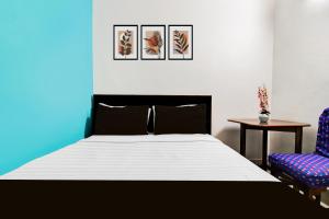 Ένα ή περισσότερα κρεβάτια σε δωμάτιο στο Hotel O Akash Namostay