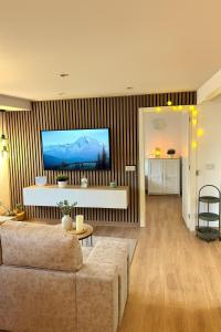 TV a/nebo společenská místnost v ubytování Tu hogar en Sevilla