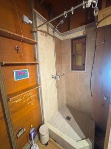 a shower stall in a bathroom with a toilet at Amanda Relax and nature beautiful beach in Playa Hermosa +22 photos