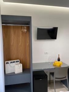 a kitchen with a table with a bottle of wine at B&B Cariddi Rooms in Caltanissetta