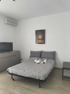 Ένα ή περισσότερα κρεβάτια σε δωμάτιο στο Appartamento Muscatel