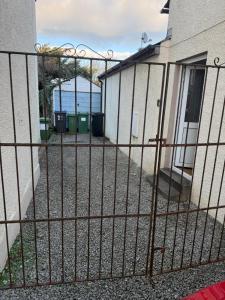 a fence with the ocean in the background at Cockermouth Cottage - Lakes - Parking in Cockermouth +15 photos