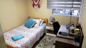 Ένα ή περισσότερα κρεβάτια σε δωμάτιο στο Departamento a pasos de la ruta 160