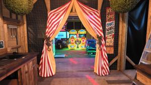 an entrance to a room with a circus tent at Sheepy Lodge by SkyBears Holidays - Puppy Lounge, Arcades, Games room in Faldingworth