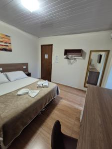 Ένα ή περισσότερα κρεβάτια σε δωμάτιο στο Hotel Serra do Mar