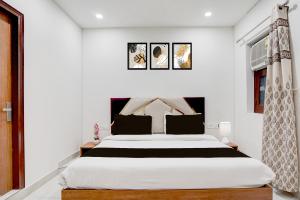 Ένα ή περισσότερα κρεβάτια σε δωμάτιο στο Townhouse Sarai Rohilla Railway Station Formerly Fortune Residency