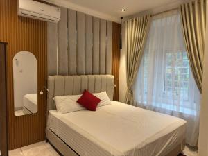 Ένα ή περισσότερα κρεβάτια σε δωμάτιο στο Eton Asia Villas-Kota Bunga +96 φωτογραφίες