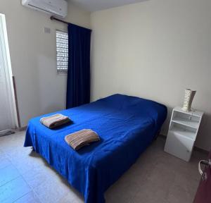 Ένα ή περισσότερα κρεβάτια σε δωμάτιο στο Depto Clarita