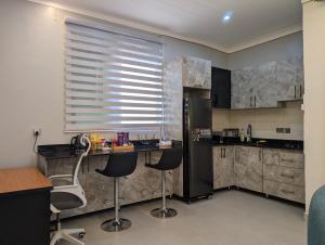 Kuchyň nebo kuchyňský kout v ubytování Hakuna Matata Apartment in Munyonyo