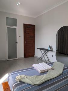 Postel nebo postele na pokoji v ubytování Hakuna Matata Apartment in Munyonyo