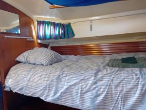 a bed in the back of a boat at Voilier au Port de Perros-Guirec in Perros-Guirec +1 photo