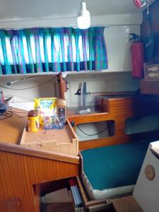 a model of a kitchen in a toy boat at Voilier au Port de Perros-Guirec in Perros-Guirec