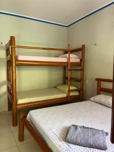 a bedroom with two bunk beds and a bed at Pousada Imperio dos Bambus in Jijoca de Jericoacoara +6 photos