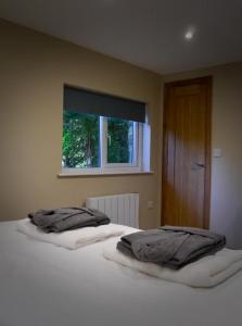 Ένα ή περισσότερα κρεβάτια σε δωμάτιο στο The Ferny Hoolet