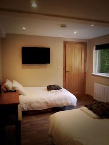 Ένα ή περισσότερα κρεβάτια σε δωμάτιο στο The Ferny Hoolet