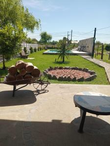 a pile of logs sitting on a table in a park at La Soñada in San Miguel del Monte