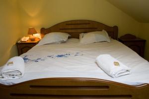 Giường trong phòng chung tại Pension Mellis Cluj Napoca