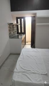 Postel nebo postele na pokoji v ubytování Sangam Villa + 8 fotografií