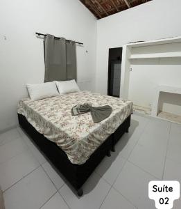 Giường trong phòng chung tại Casa Fundo de Quintal