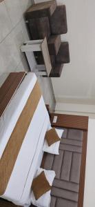 a bedroom with a large bed and a staircase at Satya Residency in Katra