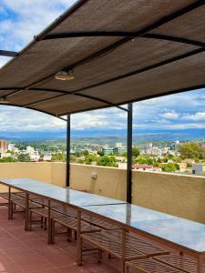 a group of tables sitting on top of a roof at Departamento en el corazón de Villa Carlos Paz in Villa Carlos Paz