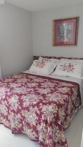 En eller flere senge i et værelse på BRISAS DO FAROL casa 208