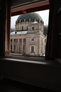 a view of a large building from a window at Panorama Domblick in St. Blasien +6 photos
