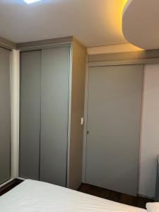 a bedroom with sliding glass doors at Centro de união da vitória in União da Vitória +6 photos