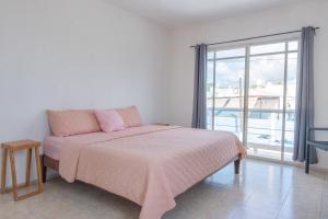 Ένα ή περισσότερα κρεβάτια σε δωμάτιο στο Casa Medina +42 φωτογραφίες