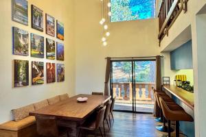 a dining room with a wooden table and chairs at Pine Hill Hideaway in Stateline