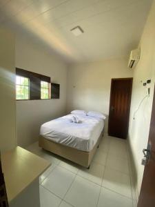 Ένα ή περισσότερα κρεβάτια σε δωμάτιο στο Casa de Fagundes PB