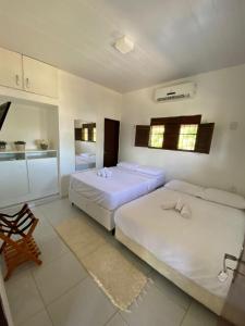 Ένα ή περισσότερα κρεβάτια σε δωμάτιο στο Casa de Fagundes PB